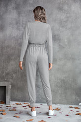 Combinaison à manches longues avec cordon de serrage à la taille